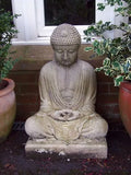 Stone Meditating Buddha garden statue seated on a square plinth