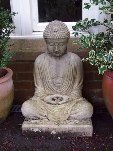Stone Meditating Buddha garden statue seated on a square plinth