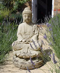 Stone Lotus Buddha garden statue seated on a lotus base